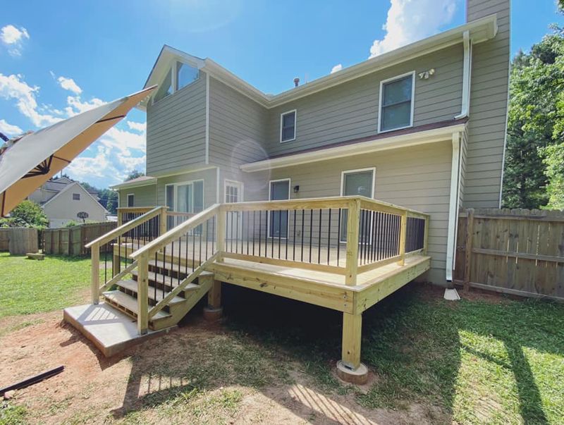 Completed deck build showing full backyard connection