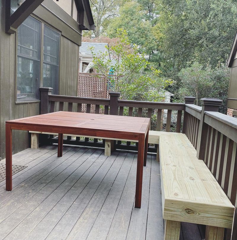 Built-in deck bench and outdoor dining table creating a complete deck seating area