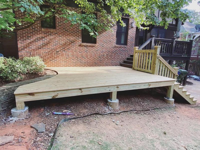 Wide-angle view of completed floating deck platform showing full footprint and stair access