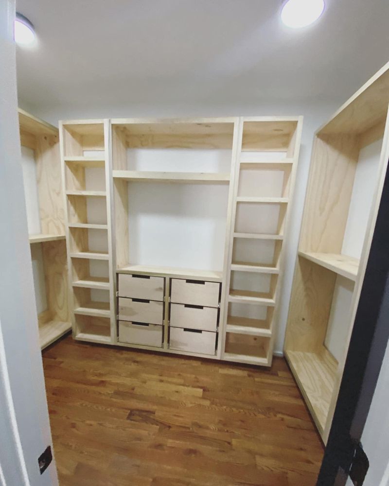 Custom built-in closet with floor-to-ceiling shelving and hanging sections