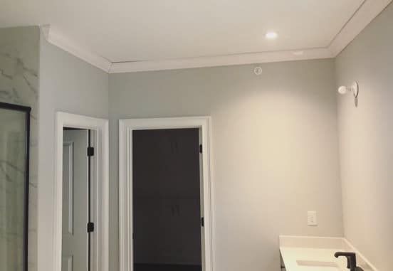 Crown molding in bathroom with clean ceiling line