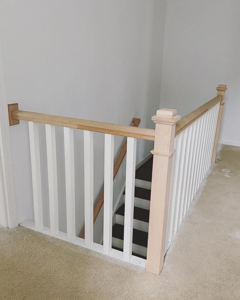 Upgraded railing with square craftsman newel posts and flat balusters