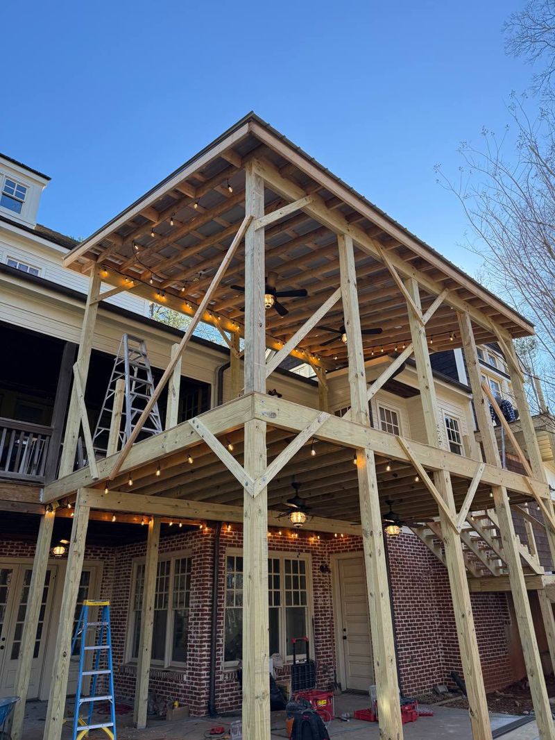 Outdoor living space with dual ceiling fans and composite stair treads