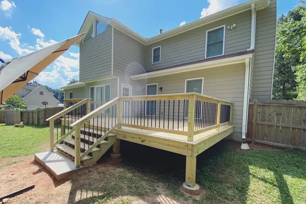 Completed deck build showing full backyard connection