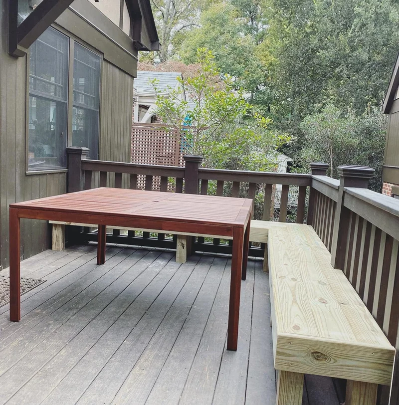 Built-in deck bench and outdoor dining table creating a complete deck seating area