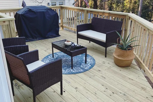 Rebuilt pressure-treated deck in Roswell with fresh decking and secure railing system