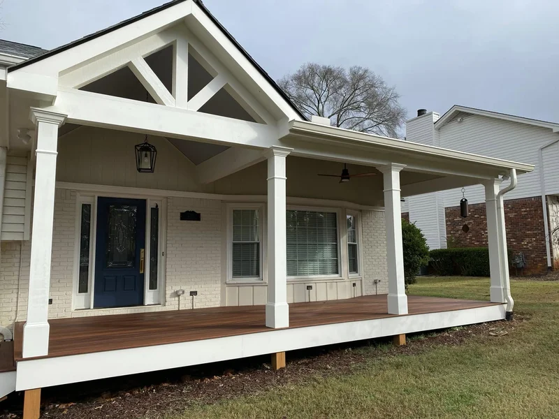 Custom front porch with hardwood decking and beadboard ceiling