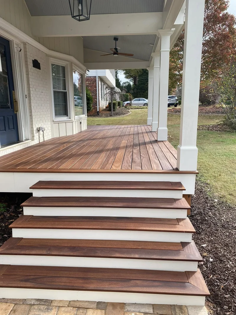 Hardwood stair treads with mitered nosing and white-painted risers
