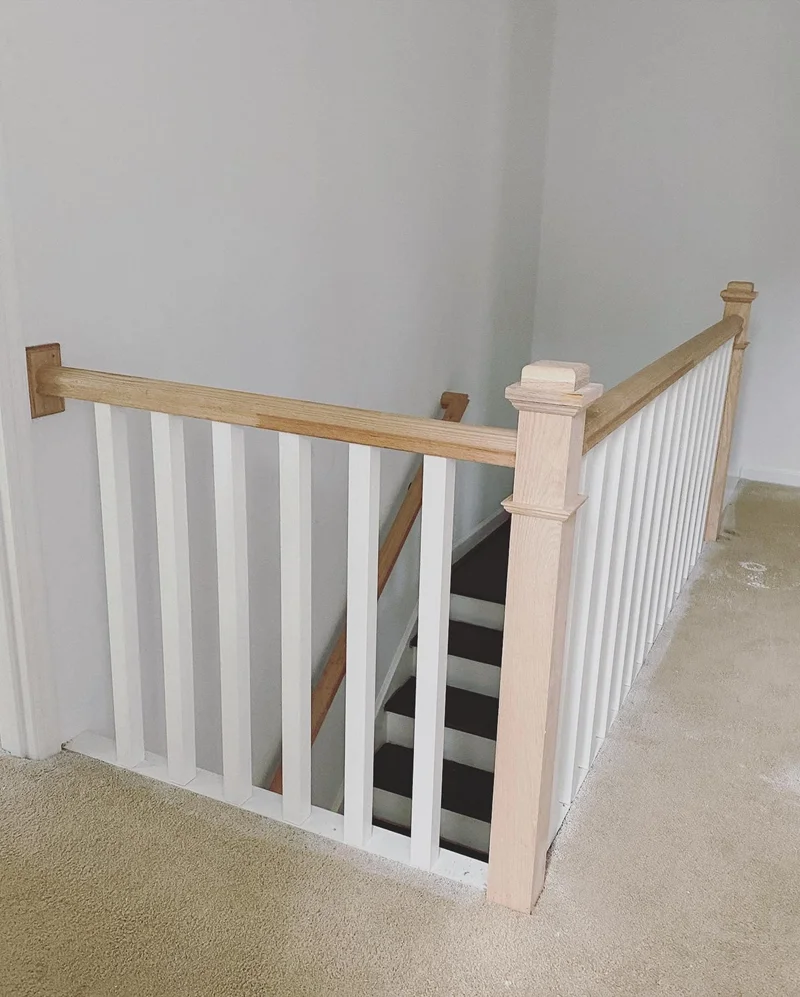 Upgraded railing with square craftsman newel posts and flat balusters